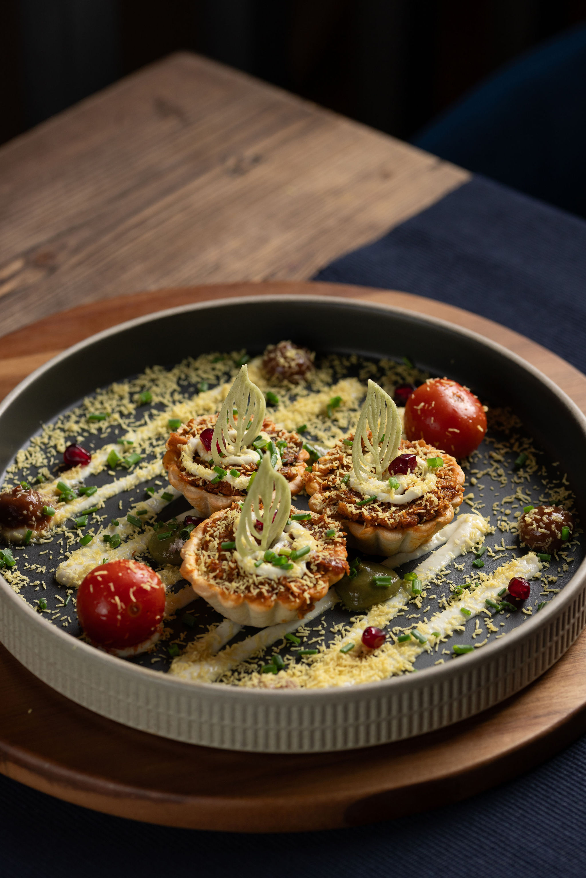 Samosa tartlets at Késarum — classical samosa filling reimagined as delicate baked tartlets